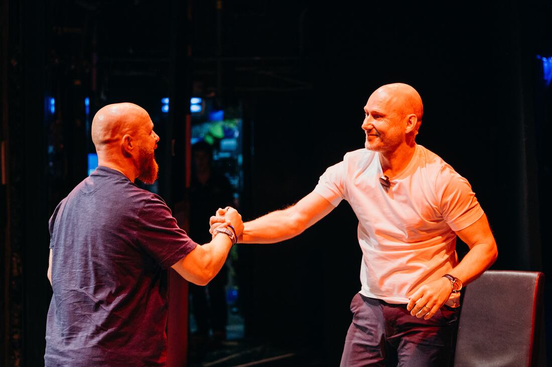 A handshake on stage, Inspire Beyond 2026.