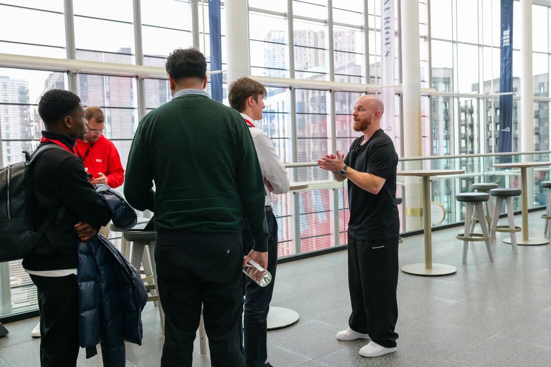 Luke Staton talking with graduates after the session at Wembley.